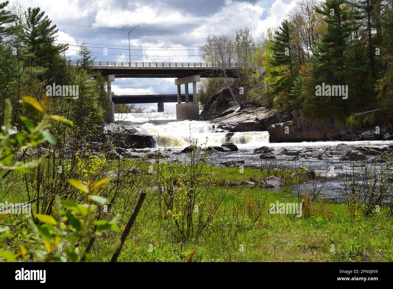 Scenic Maddington waterfalls in southern Quebec. This stream ends in the St-Lawrence waterway. However modest it’s cuteness is worth a caption. Stock Photo