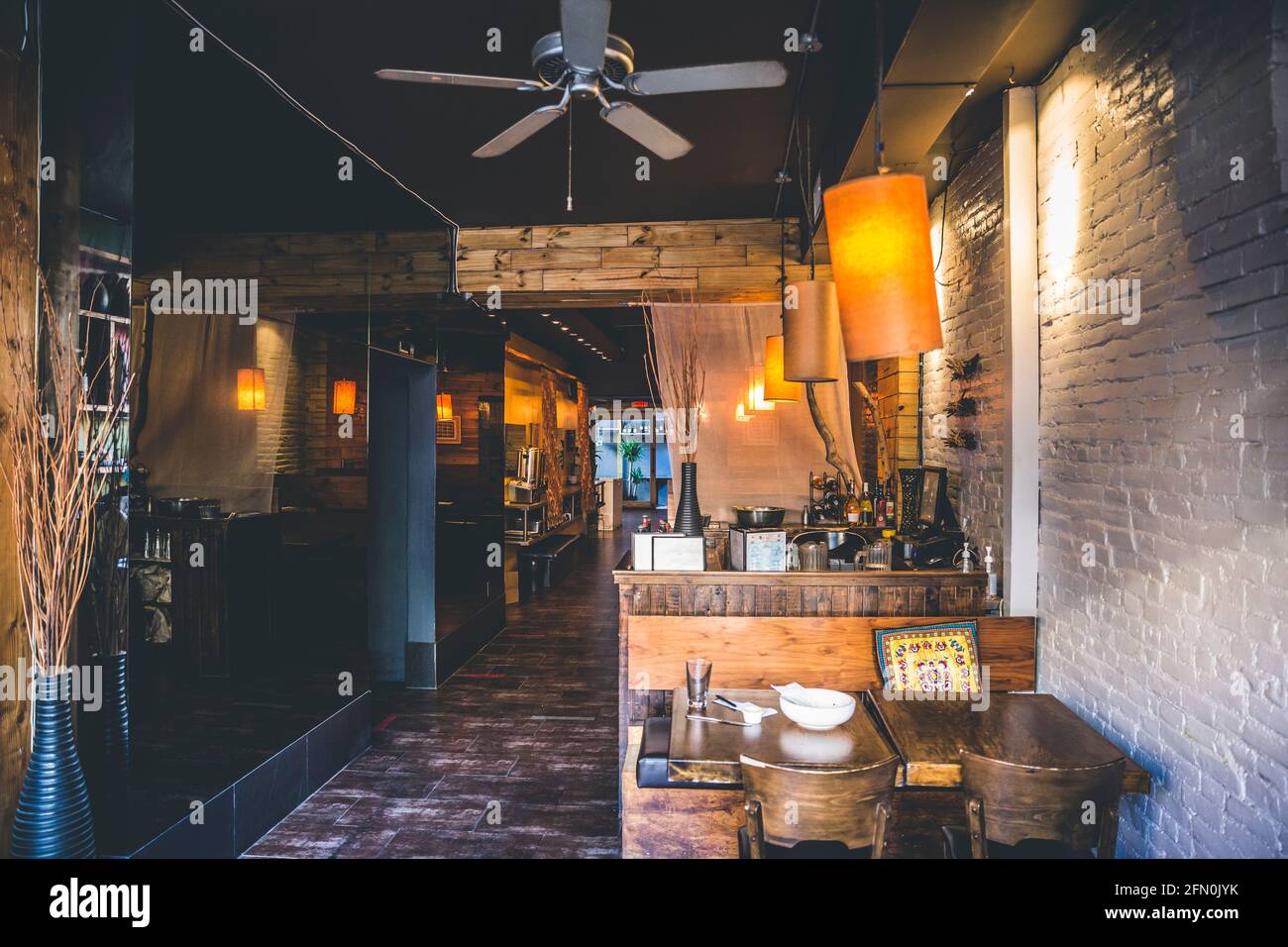 An empty interior design of a restaurant with wooden finishes and