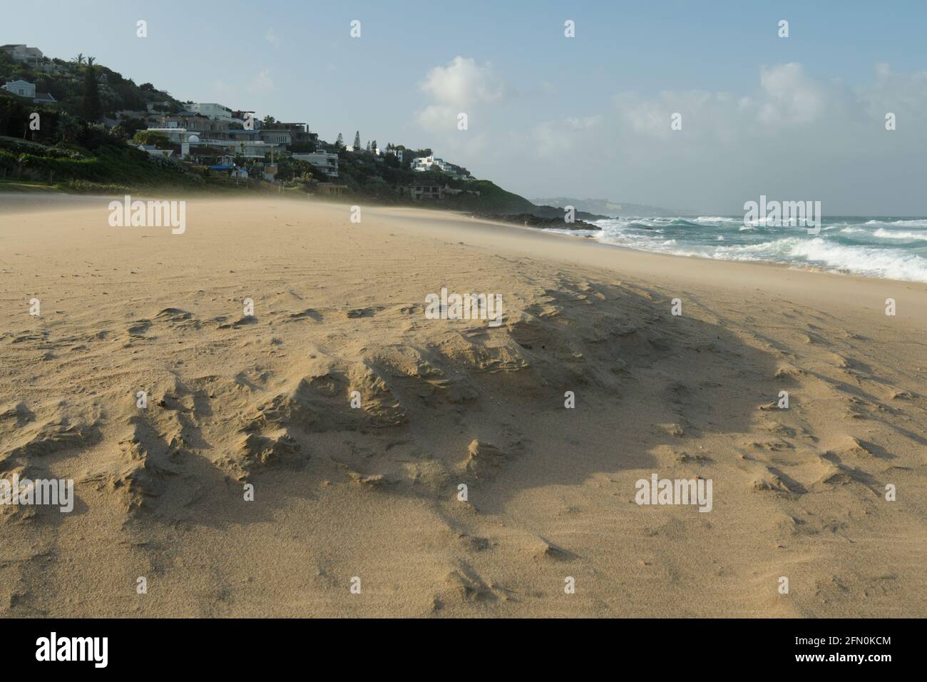 Holiday travel destination, main beach of Balito, Durban, South Africa, beautiful landscape, wind blown sand, African East Coast, waterfront houses Stock Photo