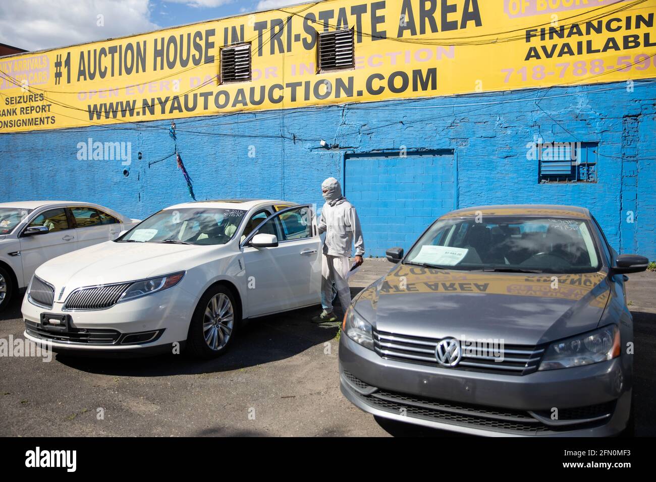 New York, USA. 12th May, 2021. A person shops for a used car at Hamilton Avenue Auto Sales, a used car dealership in the Brooklyn borough of New York, the United States, on May 12, 2021. U.S. consumer prices rose 0.8 percent in April, with a 12-month increase of 4.2 percent, the U.S. Labor Department reported Wednesday. This marked the largest 12-month growth since a 4.9-percent increase for the period ending September 2008, according to the report. Credit: Michael Nagle/Xinhua/Alamy Live News Stock Photo
