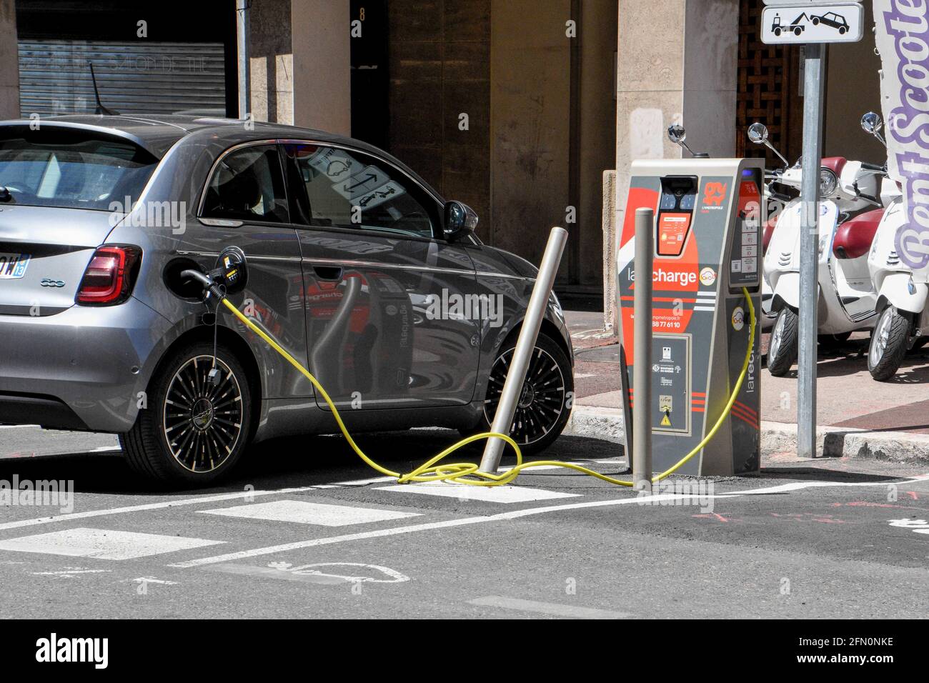 May 9, 2021, Marseille, France: An electric car recharging its batteries in  ''rue de la Loge'' Marseille..According to a study, price parity between  gasoline-powered and battery-powered cars could be reached as early