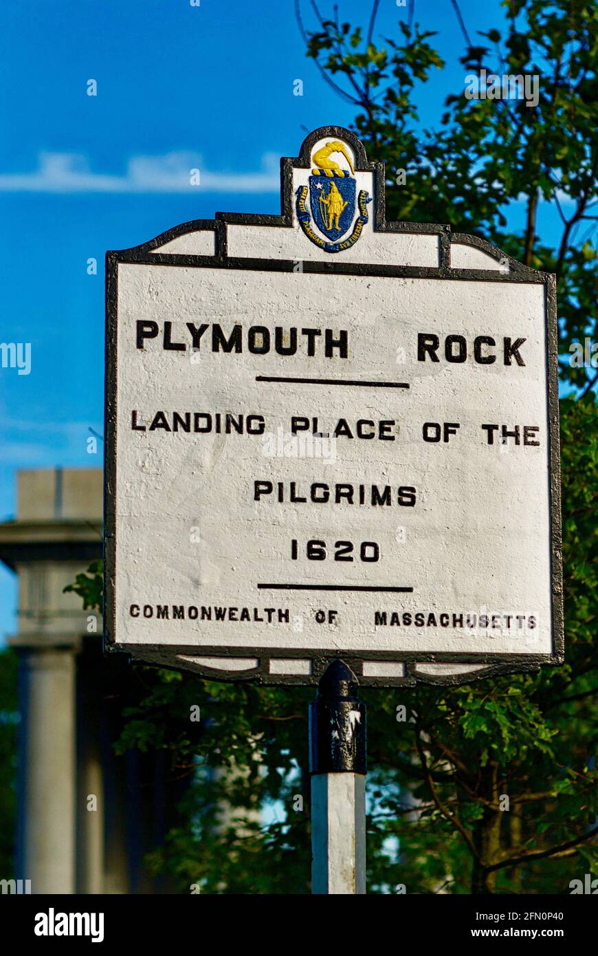 Plymouth, Massachusetts, USA - July 2, 2019: A sign for Plymouth Rock near the location where the Pilgrims of the Massachusetts Bay Colony came ashore. Stock Photo