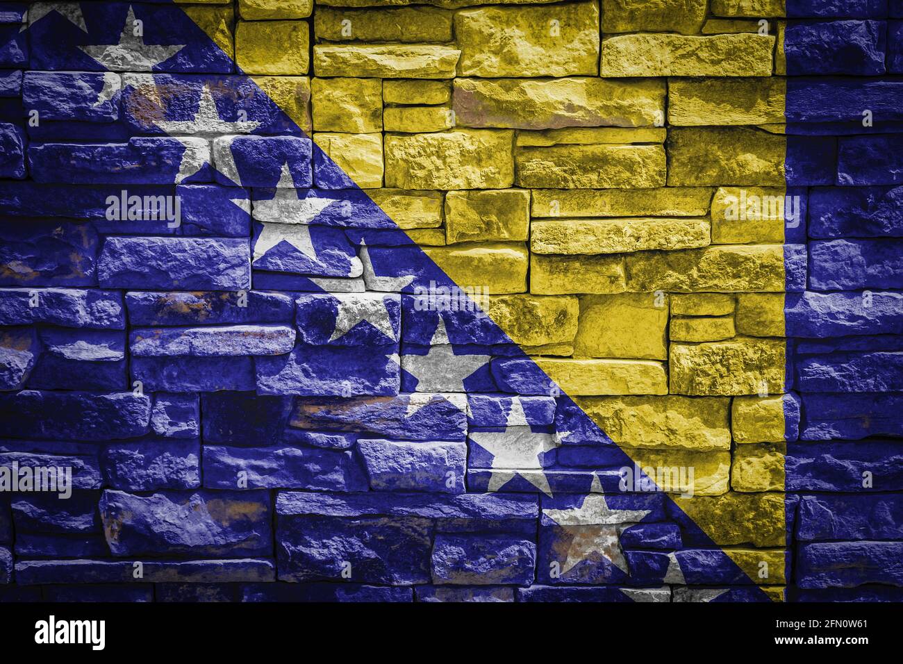 National flag of Bosnia Herzegovina on stone wall background.The ...