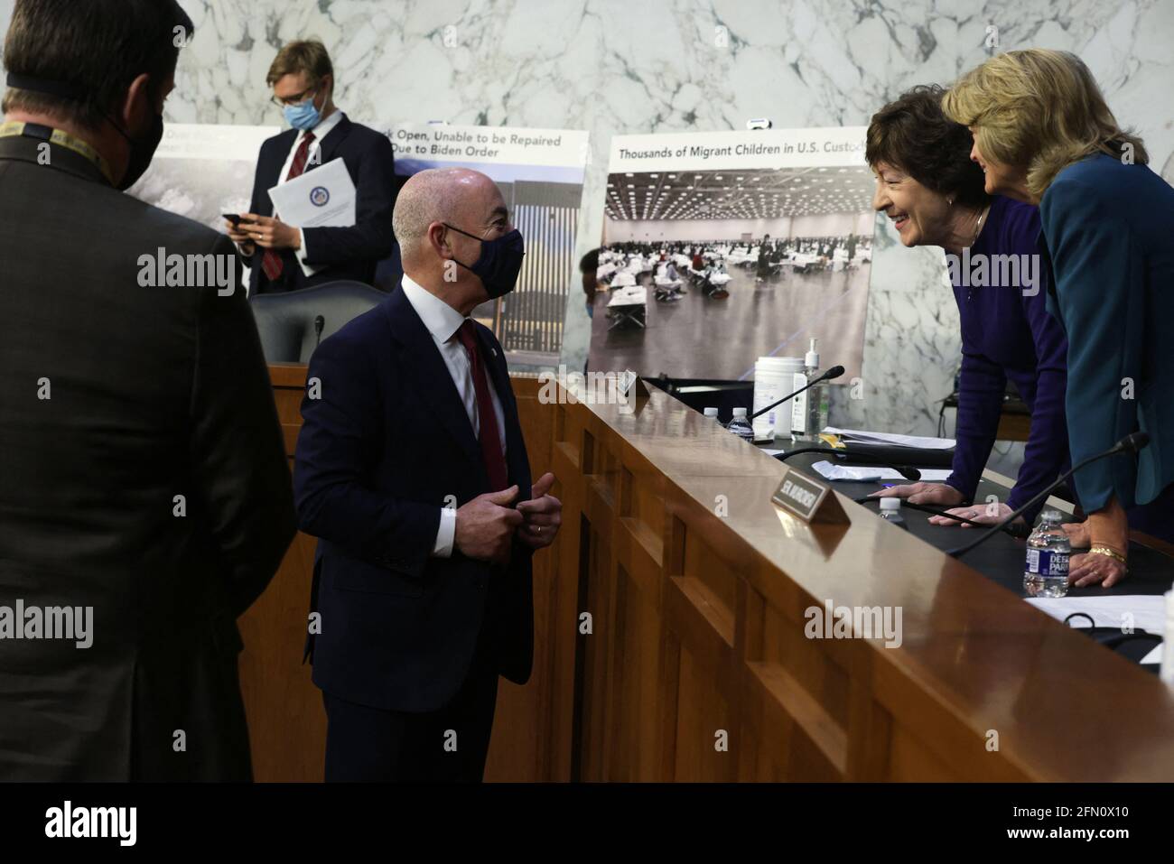 Washington, United States. 12th May, 2021. U.S. Homeland Security Secretary Alejandro Mayorkas (3rd R) talks to Sen. Susan Collins (R=ME) (2nd R) and Sen. Lisa Murkowski (R-AK) (R) during a break of a hearing before the Senate Appropriations Committee at Hart Senate Office Building on May 12, 2021 on Capitol Hill in Washington, DC, USA. The committee held a hearing on 'Domestic Violent Extremism in America.' Photo by Alex Wong/Pool/ABACAPRESS.COM Credit: Abaca Press/Alamy Live News Stock Photo