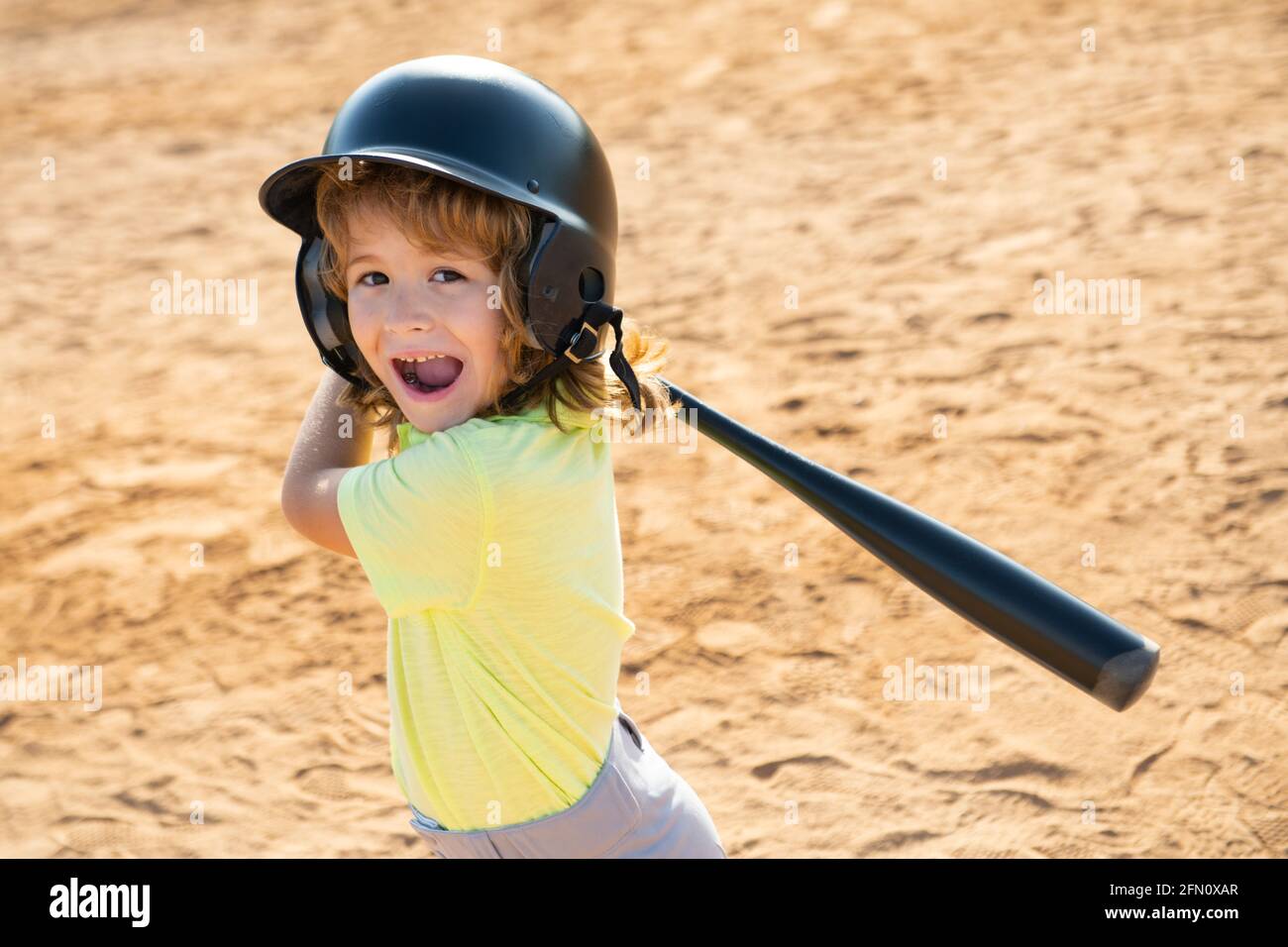 Excited child baseball player focused ready to bat. Kid holding a baseball  bat Stock Photo - Alamy