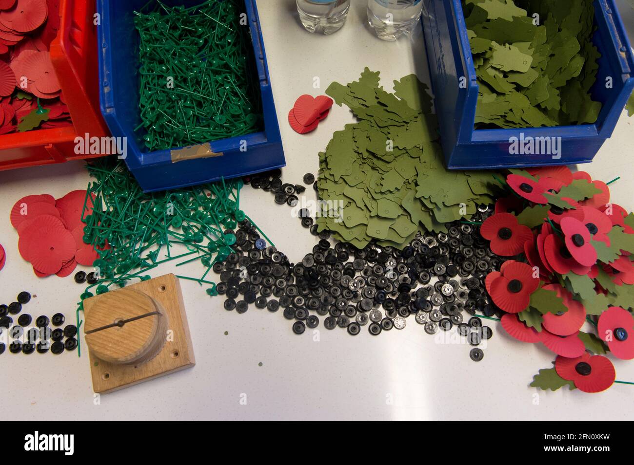 Components for making poppies, The Royal British Legion's Poppy Factory, 20 Petersham Road, Richmond, London, UK. The Poppy Factory employs ex-service personnel to makes poppies, remembrance crosses, sprays and wreaths for The Royal British Legion’s annual Appeal and Remembrance Day. The Poppy Factory is also responsible for planting and hosting The Field of Remembrance at Westminster Abbey. The Royal British Legion's Poppy Factory, 20 Petersham Road, London, UK.  16 Oct 2013 Stock Photo