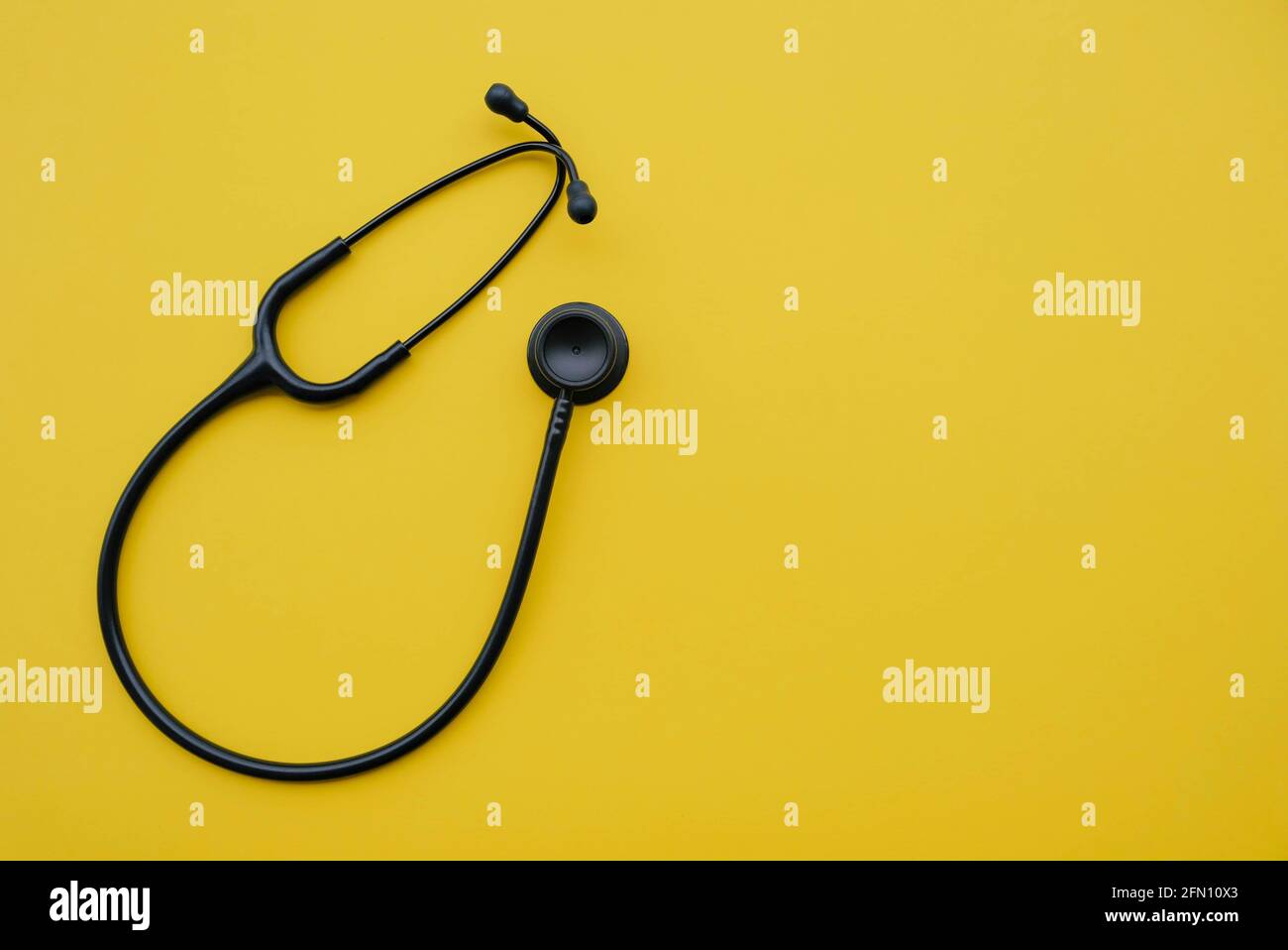 Black medical stethoscope on yellow background, top view Stock Photo - Alamy Black medical stethoscope on yellow background, top view Stock Photo - Alamy