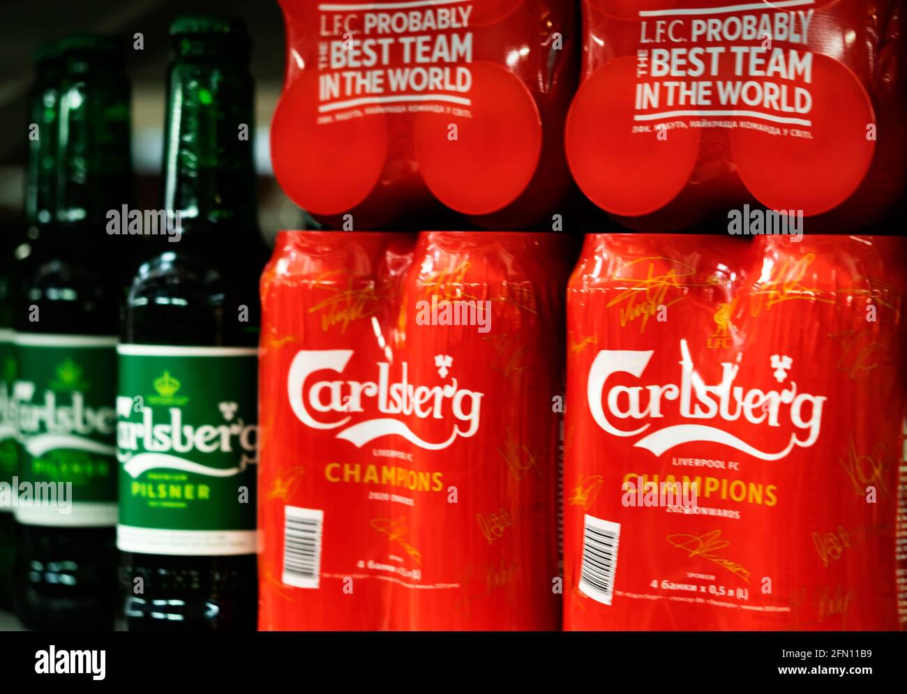 Cans and bottles of Carlsberg beer on a shelf in a store Stock Photo - Alamy