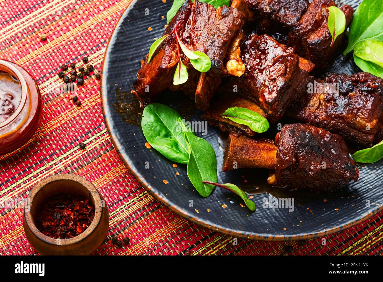 Piece of grilled beef ribs with a dark crust Stock Photo