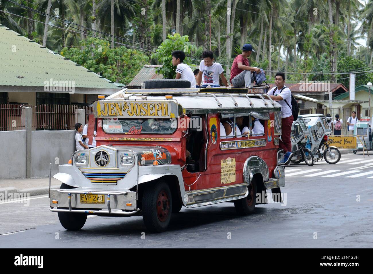 Filipinos riding a jeepney in Sorsogon province in the Philippines. Stock Photo