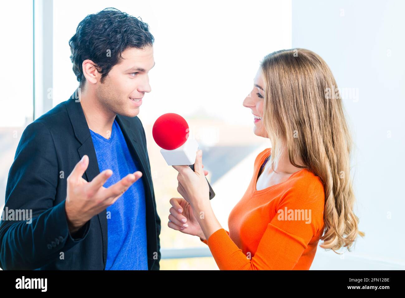 Female Radio host doing interview with Studio guest in radio station during  a show for radio live in the Studio Stock Photo - Alamy