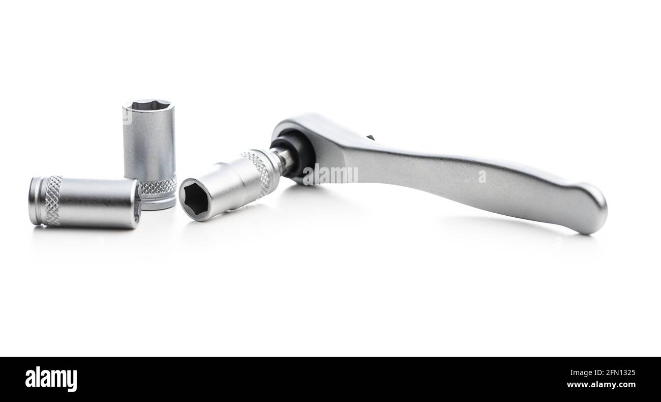 Mini ratchet wrench with set of wrench nuts isolated on white background. Ratchet wrench made from stainless steel. Stock Photo