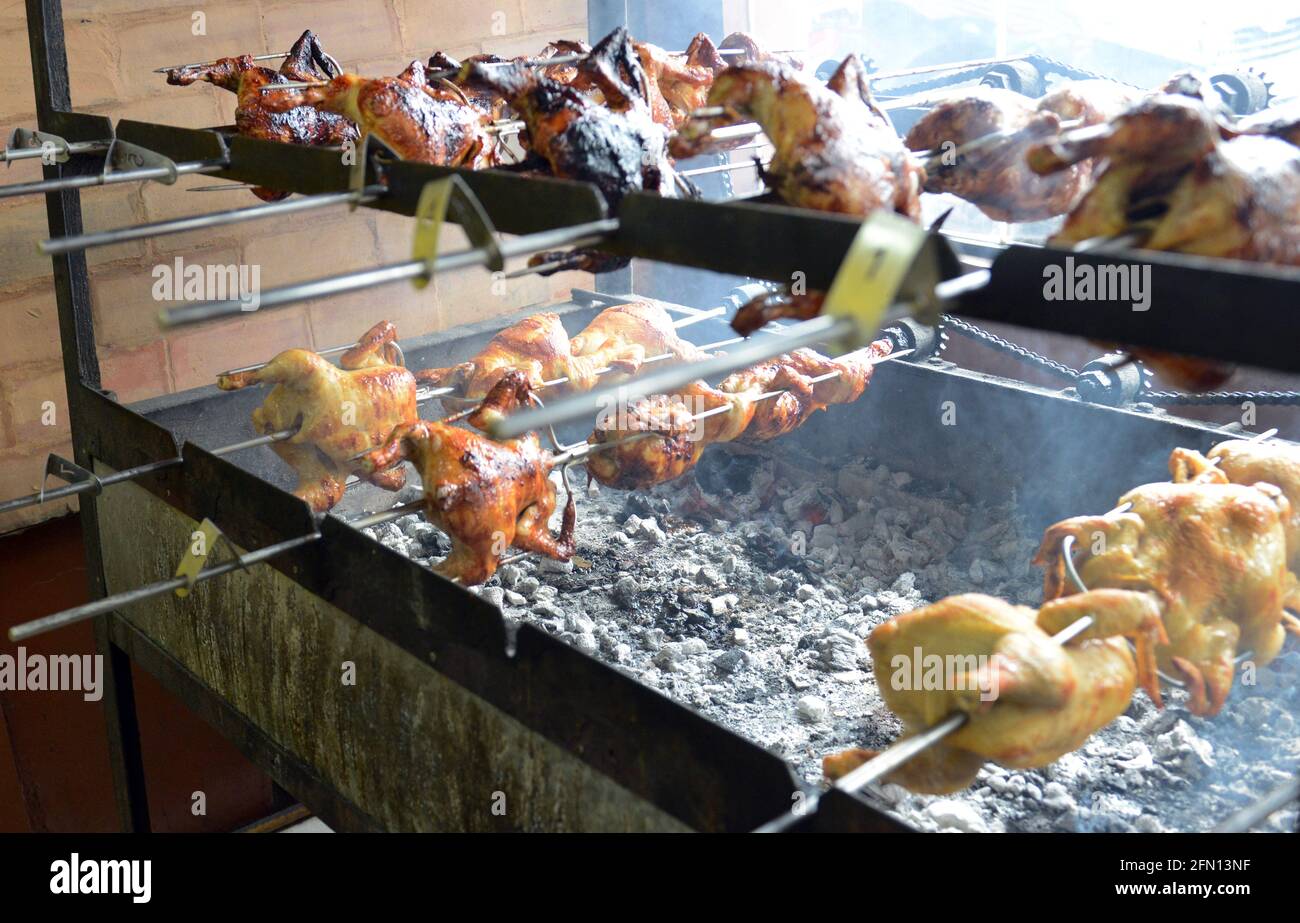 Lechon manok cooked over charcoal spit. Legazpi, Philippines. Stock Photo