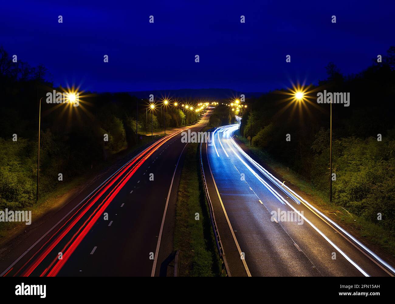 light trails on main road Stock Photo