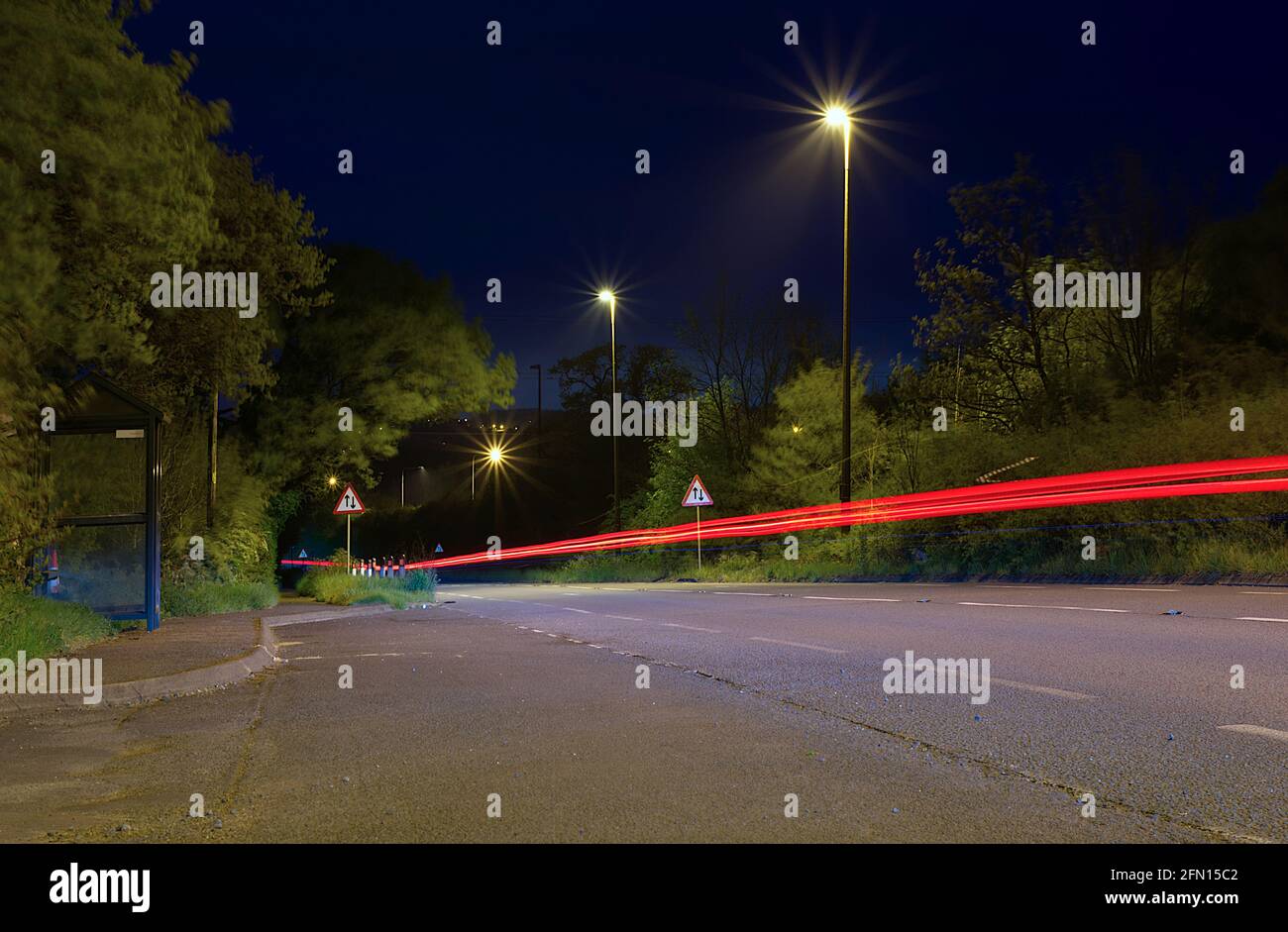 light trails on main road Stock Photo