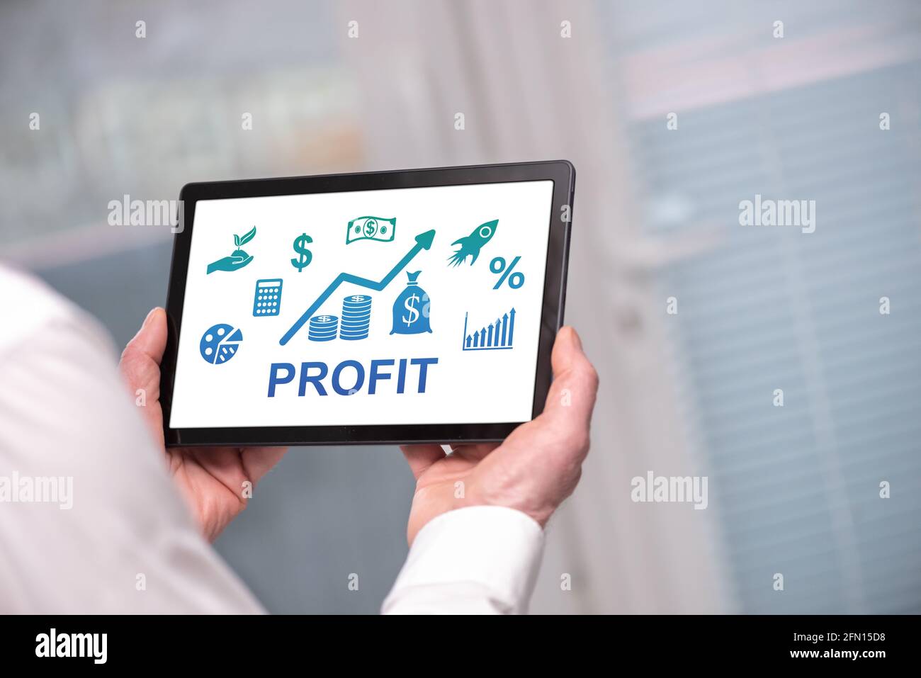 Profit concept shown on a tablet held by a man Stock Photo