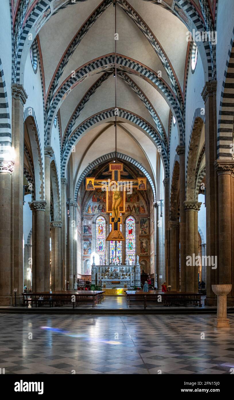 Florence, Italy, Main nave of the Basilica of Santa Maria Novella, the wwoden crucifix by Giotto Stock Photo