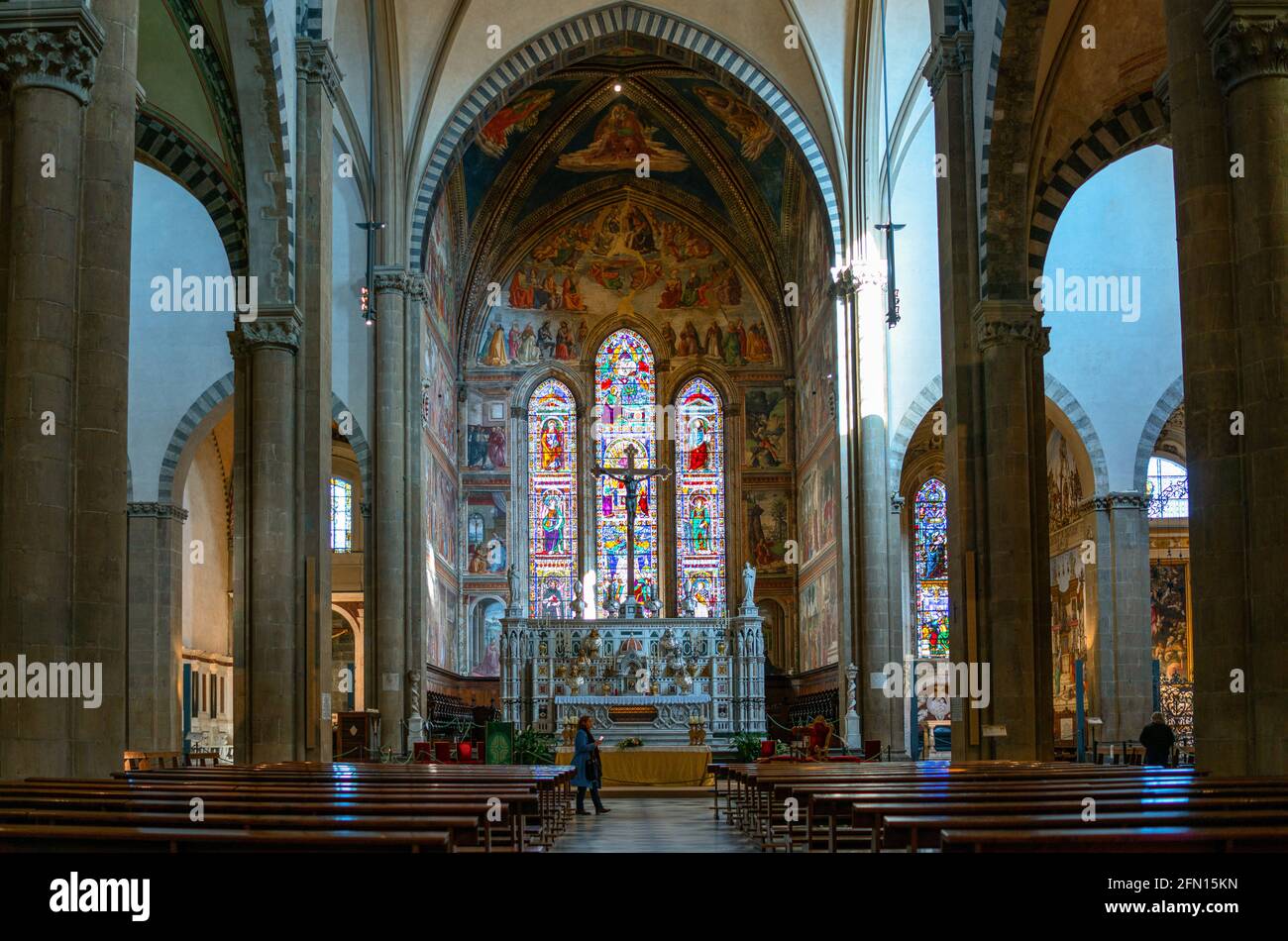 Florence, Italy, Basilica of Santa Maria Novella, the nave and the altar of he main chapel with the crucifix by Giambologna Stock Photo