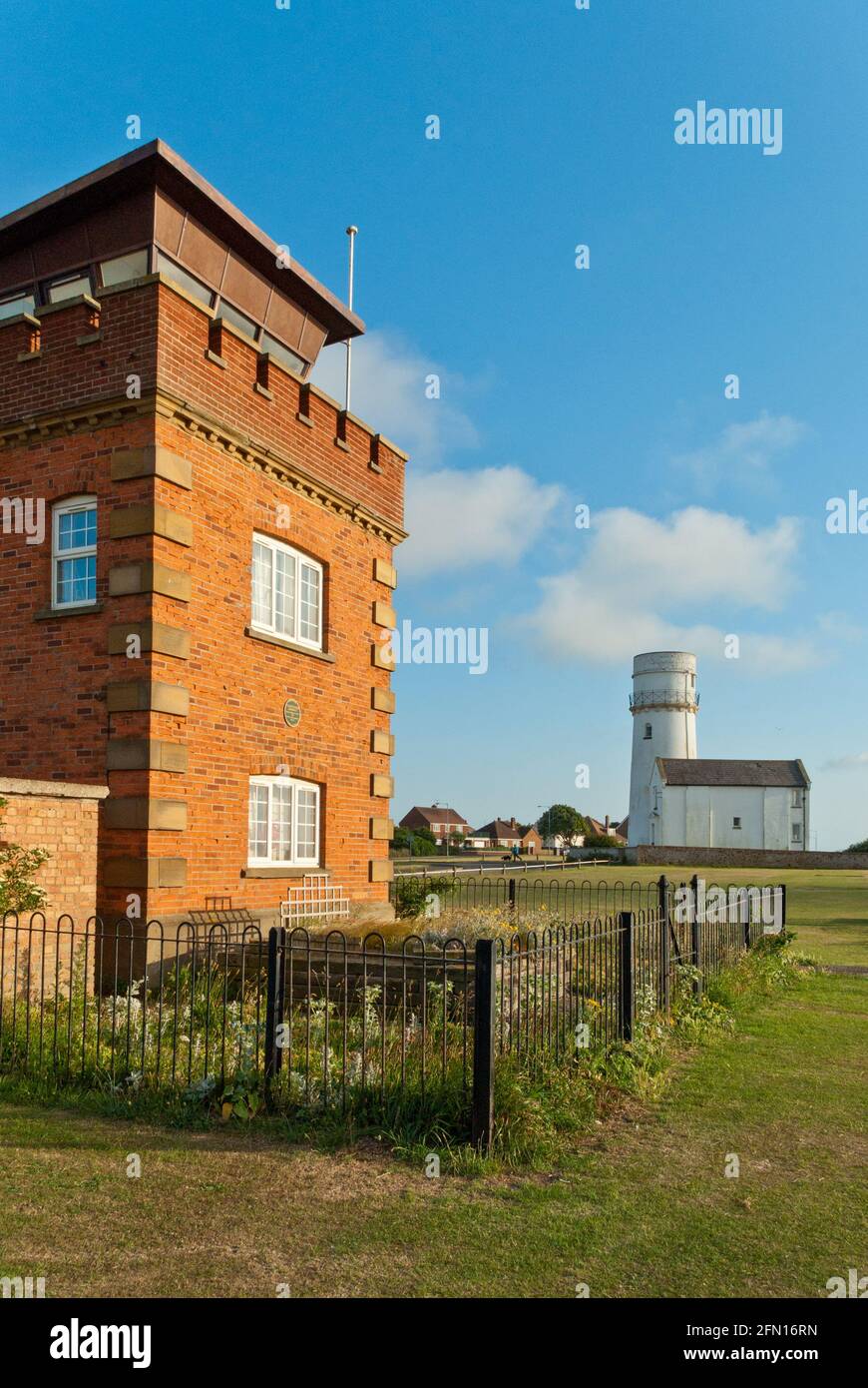 Old Hunstanton Lighthouse, with the Coastguard Lookout building in the