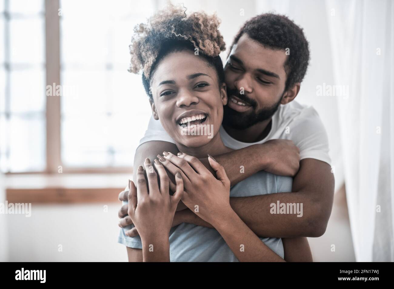Woman hugging man shoulders hi-res stock photography and images - Alamy