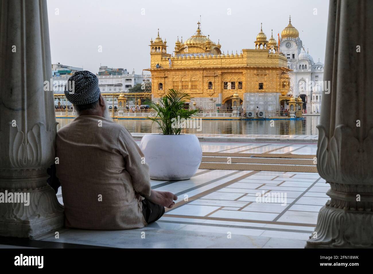 Amritsar, India - April 2021: Pilgrims visiting the Golden Temple in Amritsar on April 30, 2021 in Amritsar, Punjab, India. Stock Photo