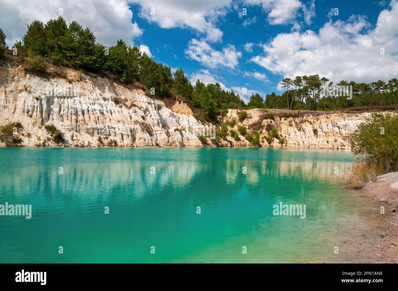 Guizengeard kaolinite quarries with artificial turquoise green lakes set in a pine and oak forest, Charente (16), Nouvelle-Aquitaine region, France Stock Photo