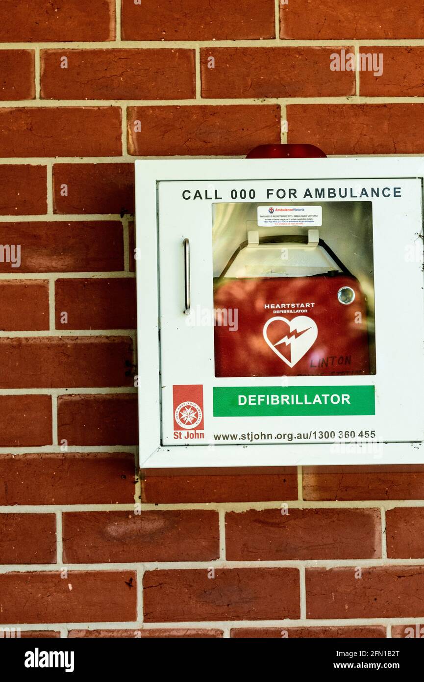 Portable emergency  Heart Defibrillator mounted in the entrance of a country Police Station Stock Photo