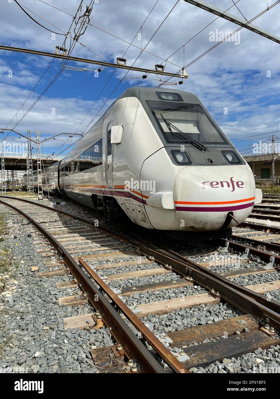 Spanish regional train running on the track Stock Photo