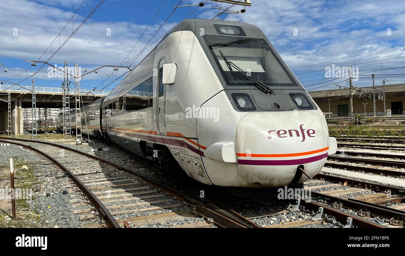 Spanish regional train running on the track Stock Photo