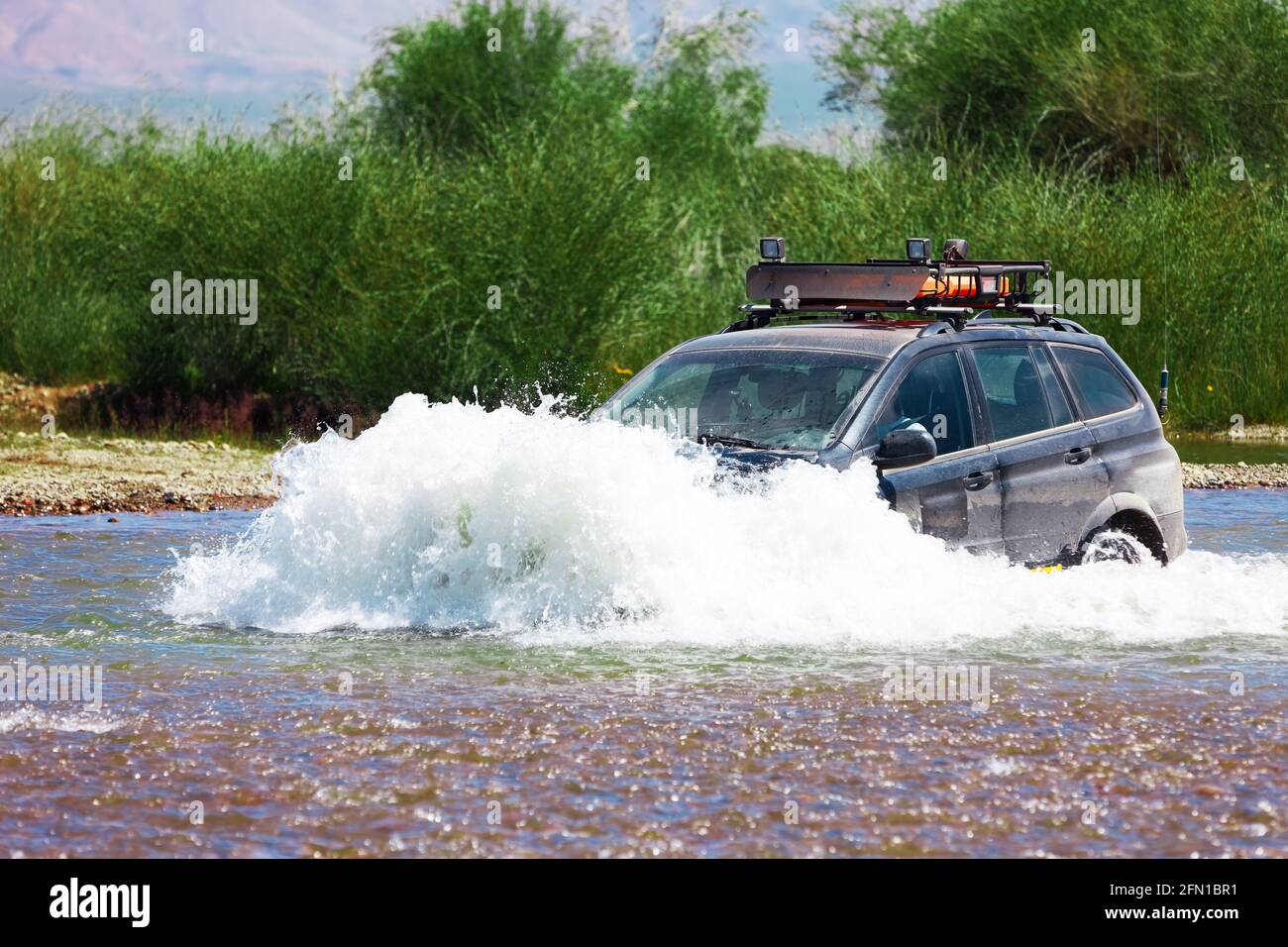 Journey of river to ford on car. Mongolia Stock Photo