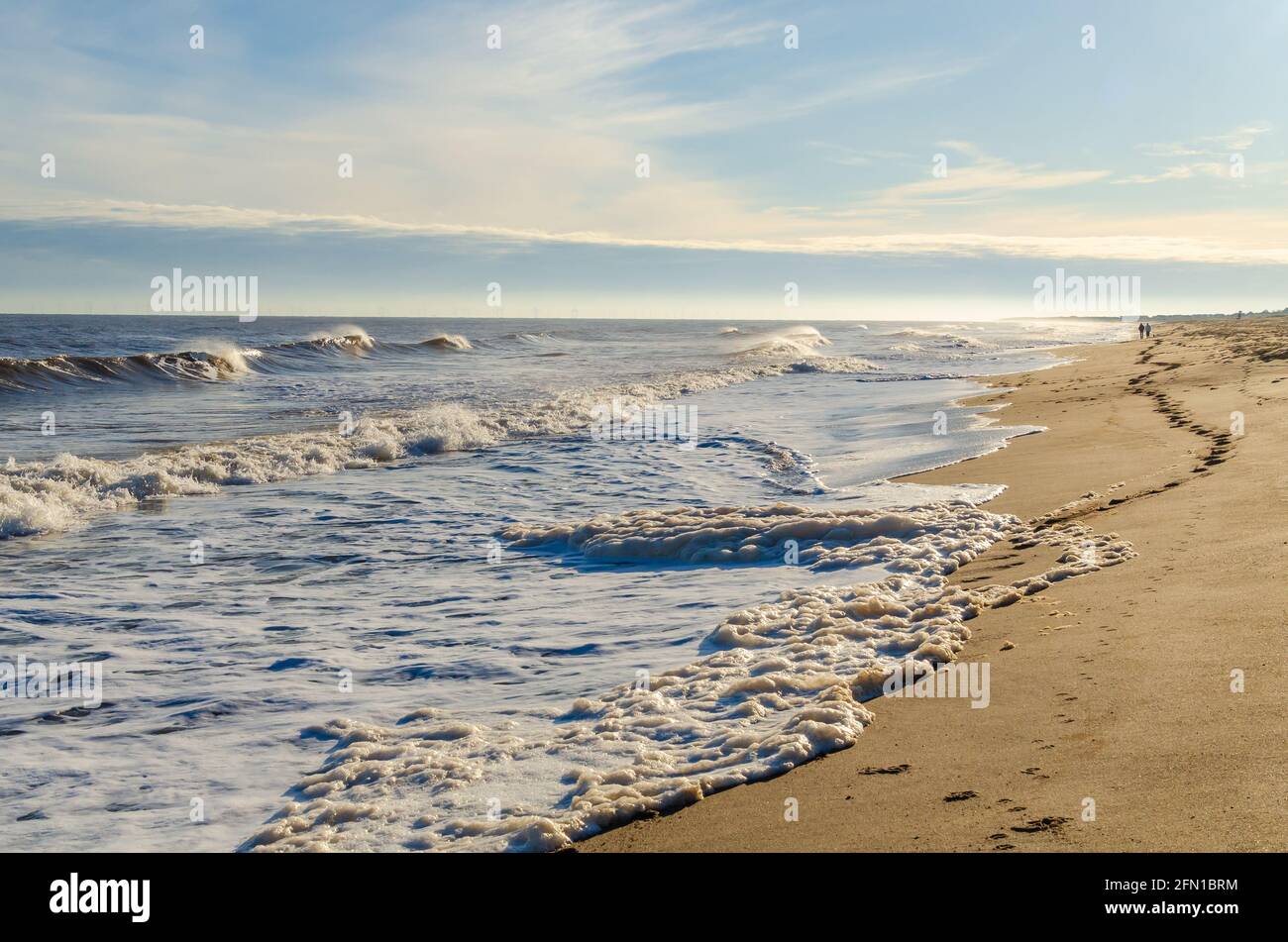 footsteps on sandy beach Stock Photo