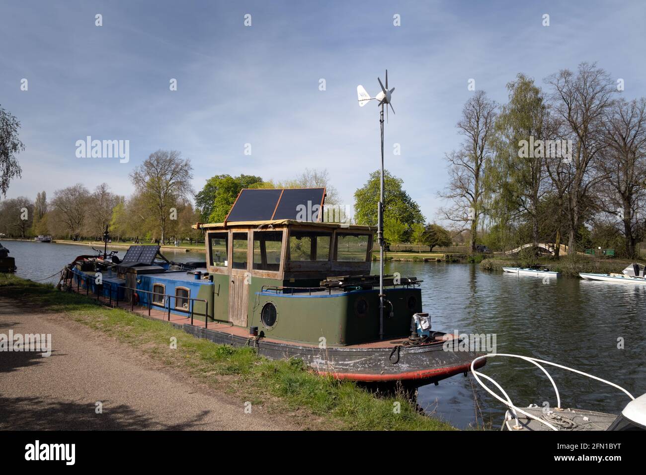 Sustainable house boat moored on the Thames, in spring, in Oxfordshire Stock Photo