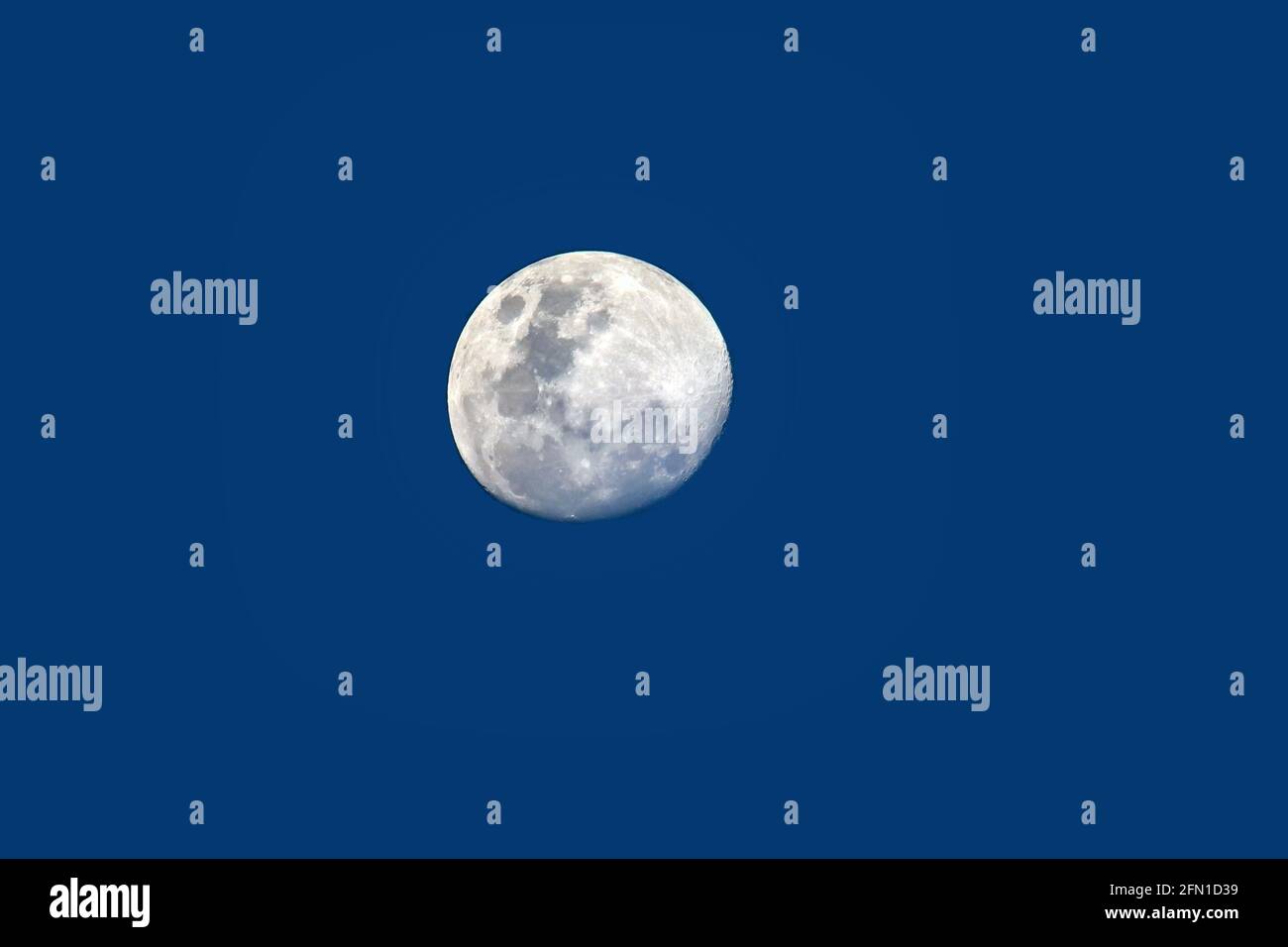 Full moon and blue sky seen from central Africa Stock Photo