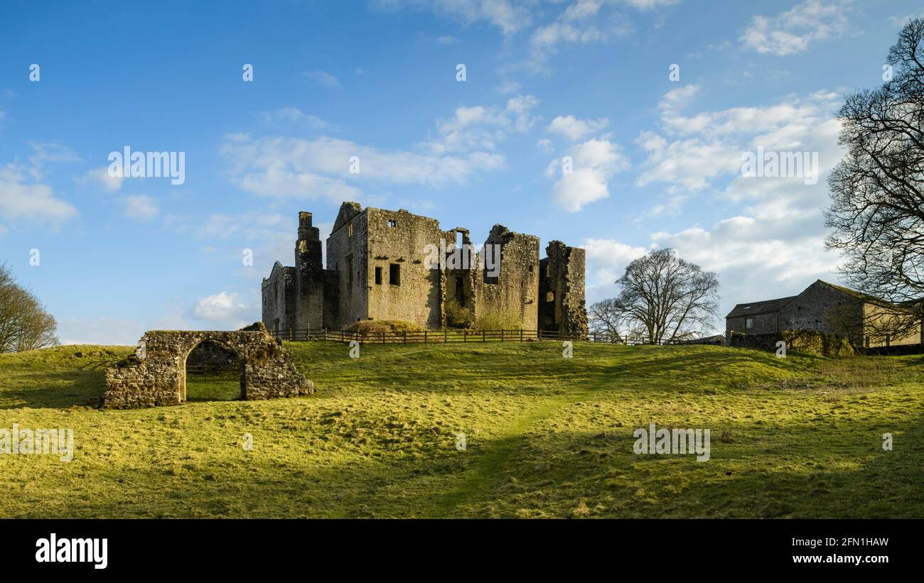 Barden Tower (sunlight on beautiful historic ancient ruin, stone arch & blue sky) - scenic rural Bolton Abbey Estate, Yorkshire Dales, England UK. Stock Photo