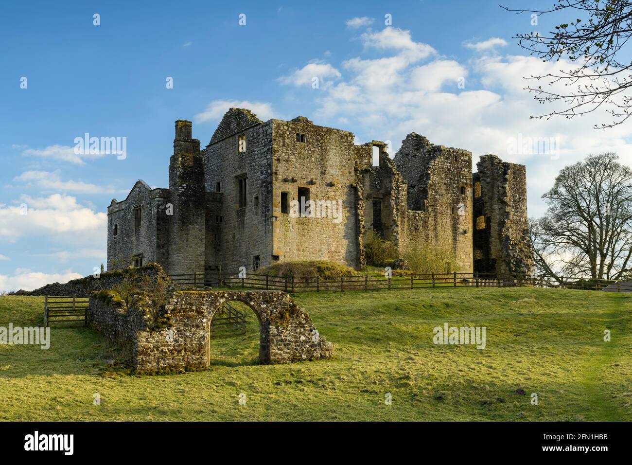 Barden Tower (sunlight on beautiful historic ancient ruin, stone arch & blue sky) - scenic rural Bolton Abbey Estate, Yorkshire Dales, England UK. Stock Photo