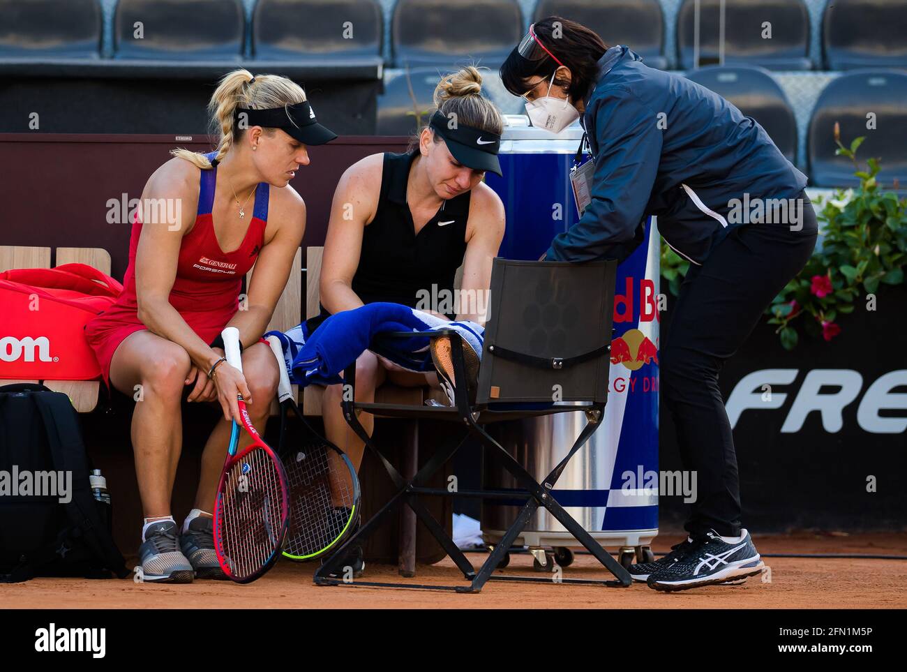 Angelique Kerber Of Germany Attends To Simona Halep After Halep Is Forced To Retire With Injury From The Second Round Of The 2021 Internazionali Bnl D Italia Wta 1000 Tennis Tournament On May