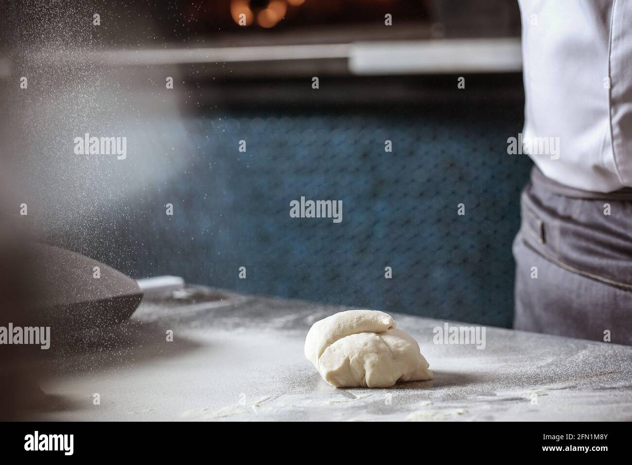Making dough for bread by male hands in restaurant kitchen. Cooking ...