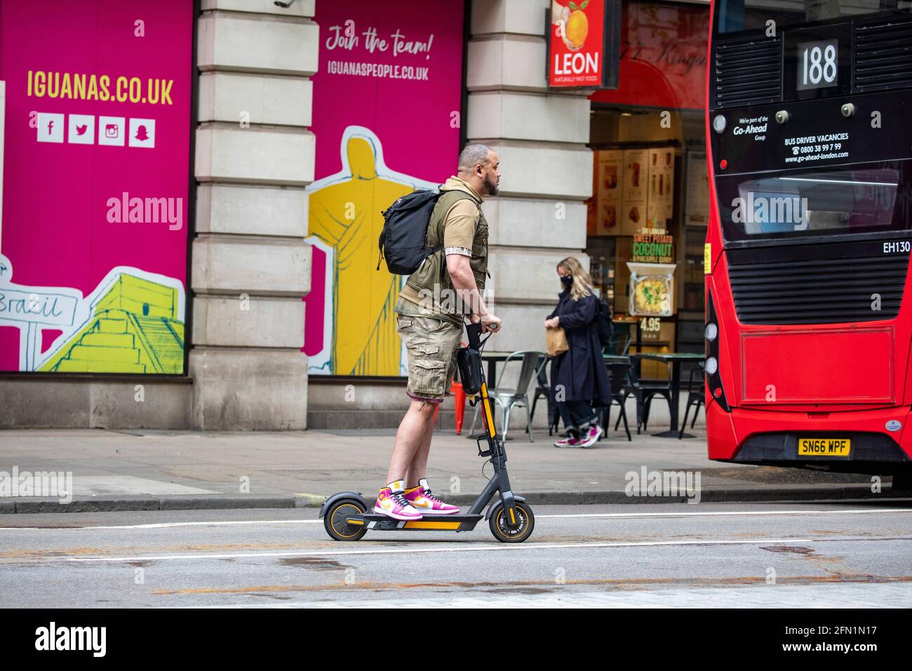 Man on electric scooter hi-res stock photography and images - Alamy