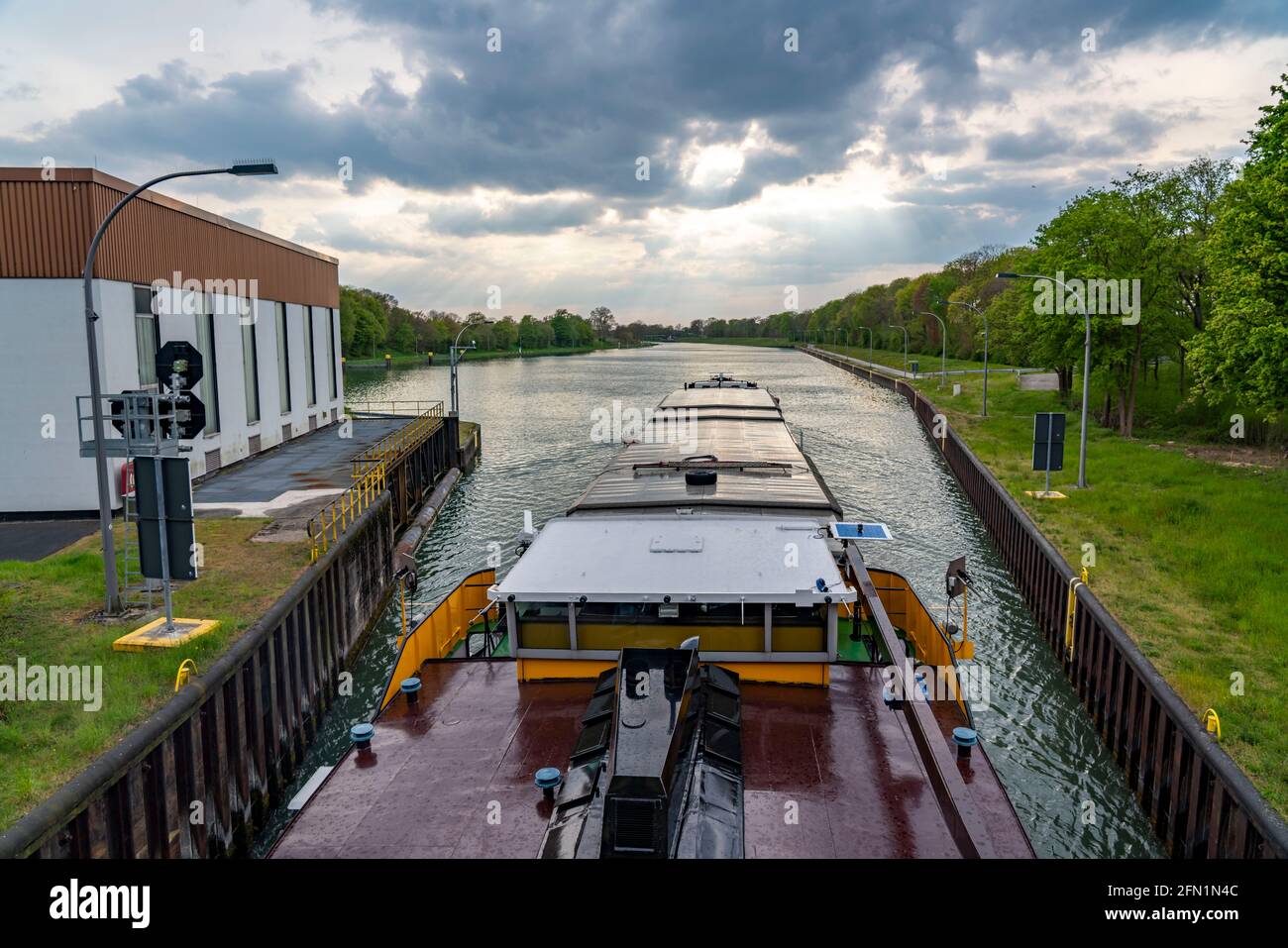 Cargo ship on the Wesel-Datteln Canal, leaving the Hünxe lock, NRW, Germany Stock Photo