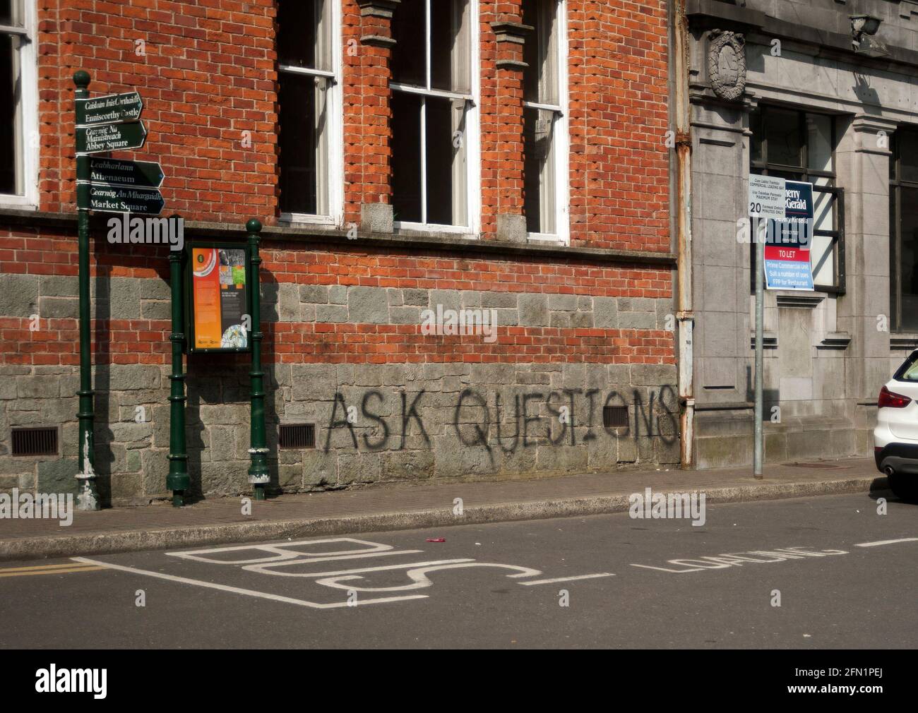 'Ask Questions' graffiti sign, Enniscorthy, County Wexford, Ireland, Europe Stock Photo