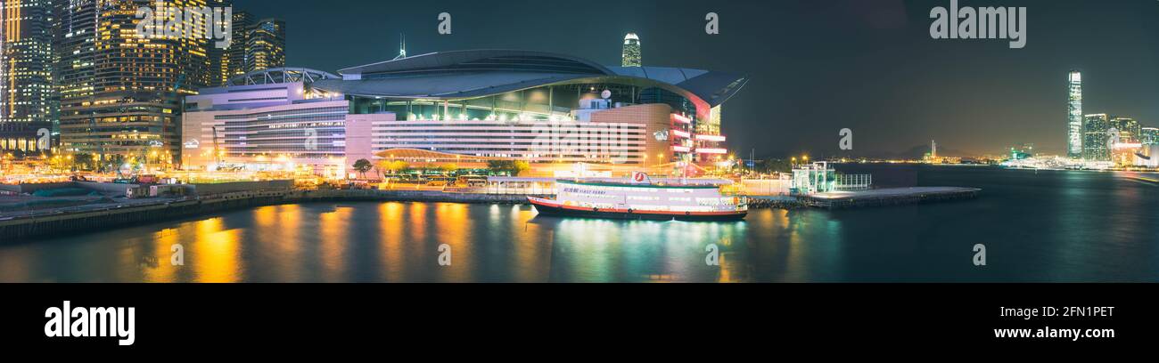 Panoramic night time shot of the Hong Kong Exhibition & Convention Center in Wanchai Stock Photo