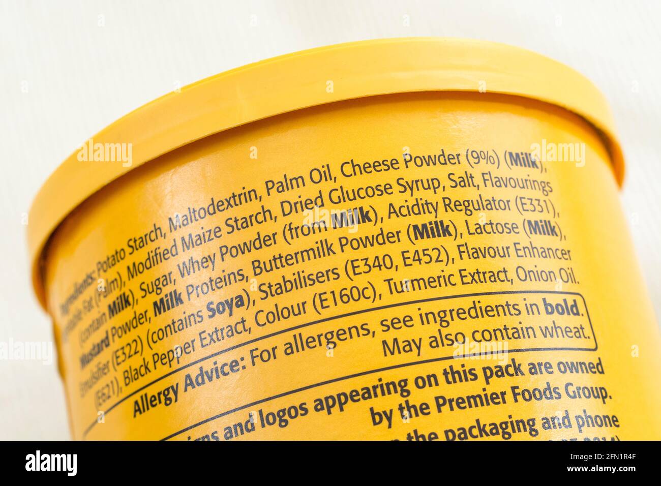 Close-up shot of Bisto Cheese Sauce Mix ingredient list showing E numbers (focus centre numbers) For food additives, E340, E452, E160c, healthy food. Stock Photo