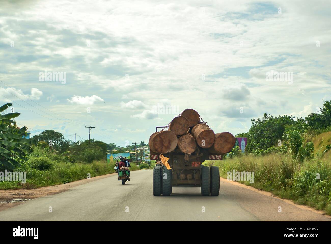 Log transporter on the national road number 3 to Douala Stock Photo