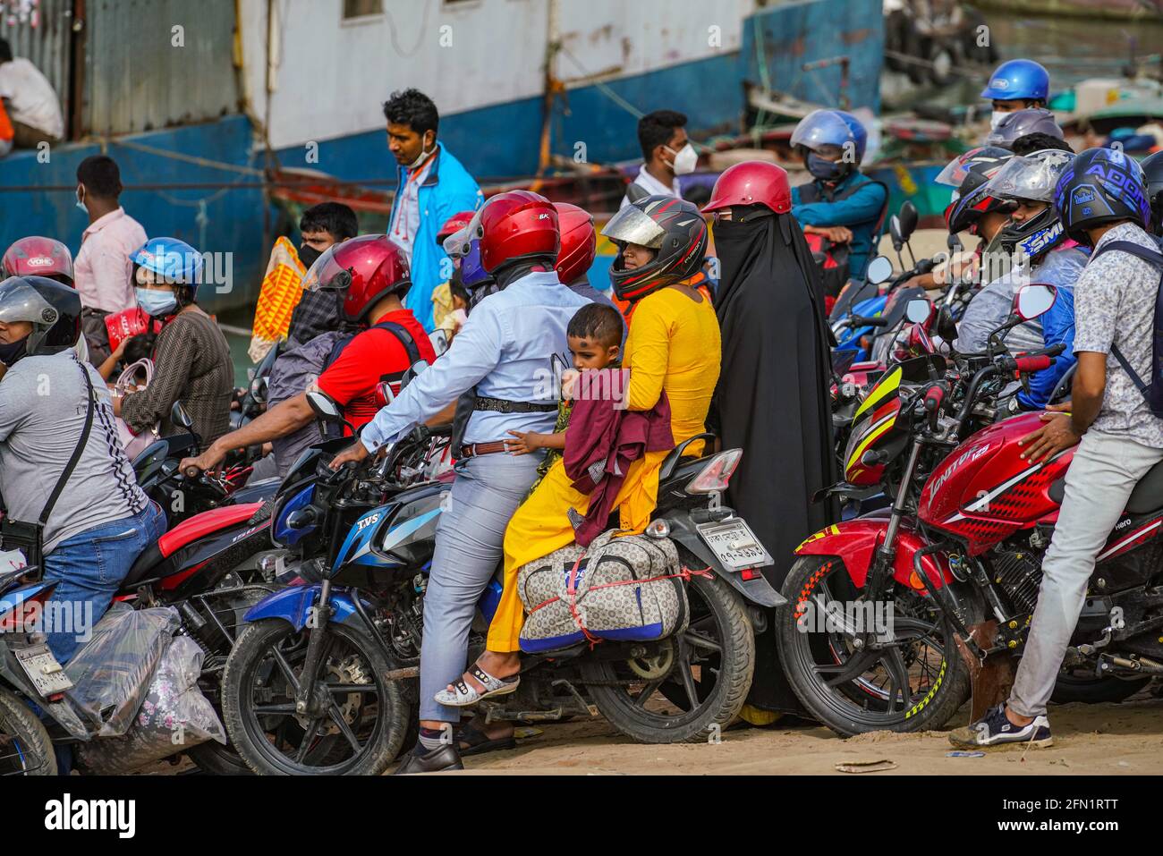 Dhaka Dhaka Bangladesh. 13th May 2021. People on motorcycles