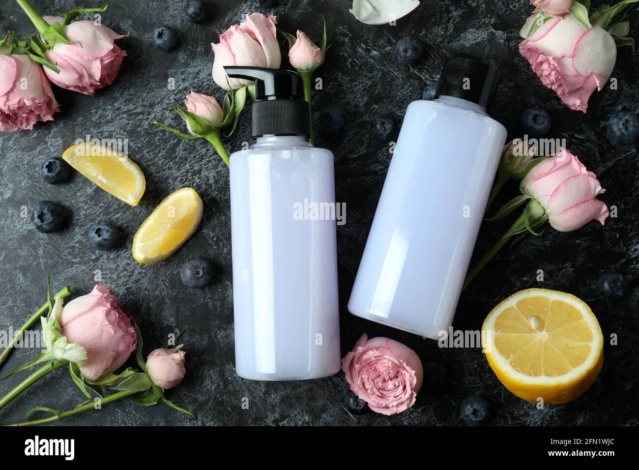 Natural shower gels and ingredients on black smokey background Stock Photo Alamy