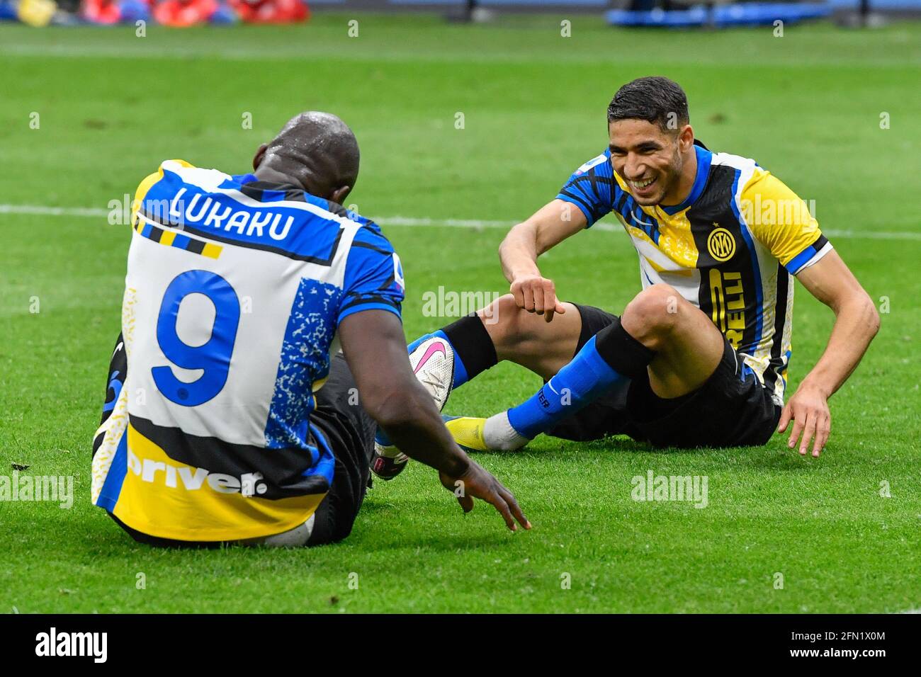 Milano, Italy. 12th May, 2021. Romelu Lukaku (9) of Inter scores for 3-1 and celebrates with Achraf Hakimi (2) during the Serie A match between Inter and Roma at Giuseppe Meazza in Milano. (Photo Credit: Gonzales Photo/Alamy Live News Stock Photo