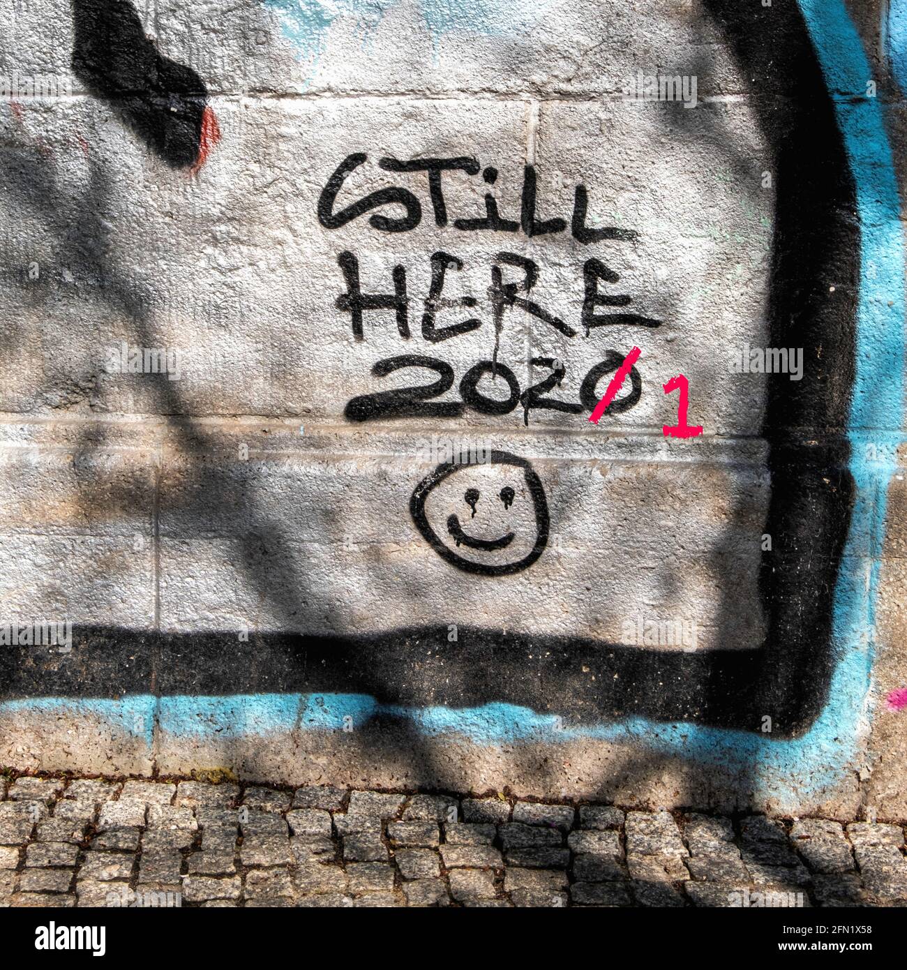 Still Here 2021 Graffiti and smiley face emoji under the Bornholmer strasse road bridge, Prenzlauer Berg Berlin Stock Photo