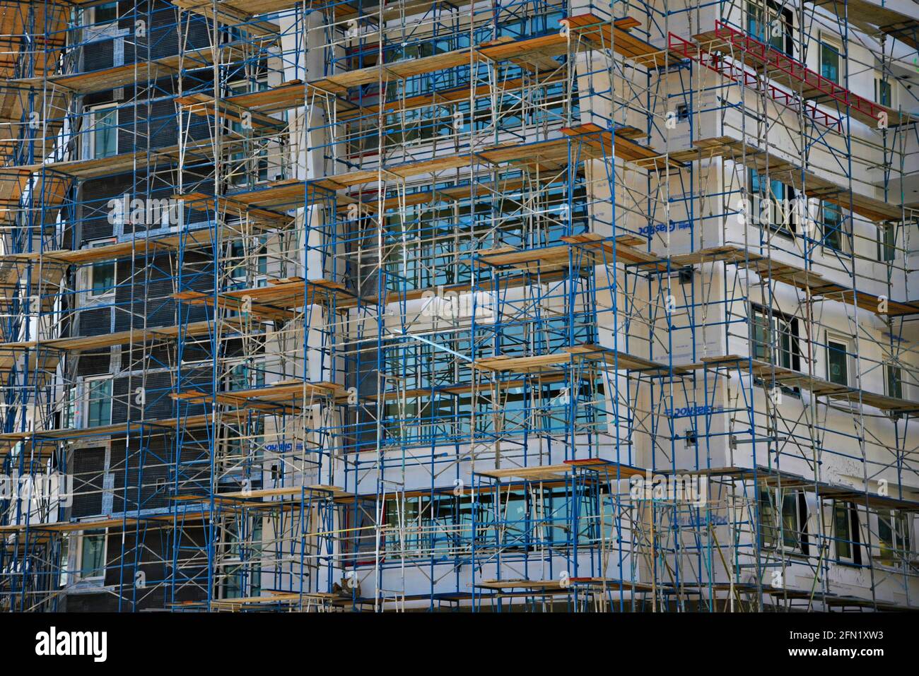 Highrise building under construction with scaffolding in downtown San Diego, California USA
