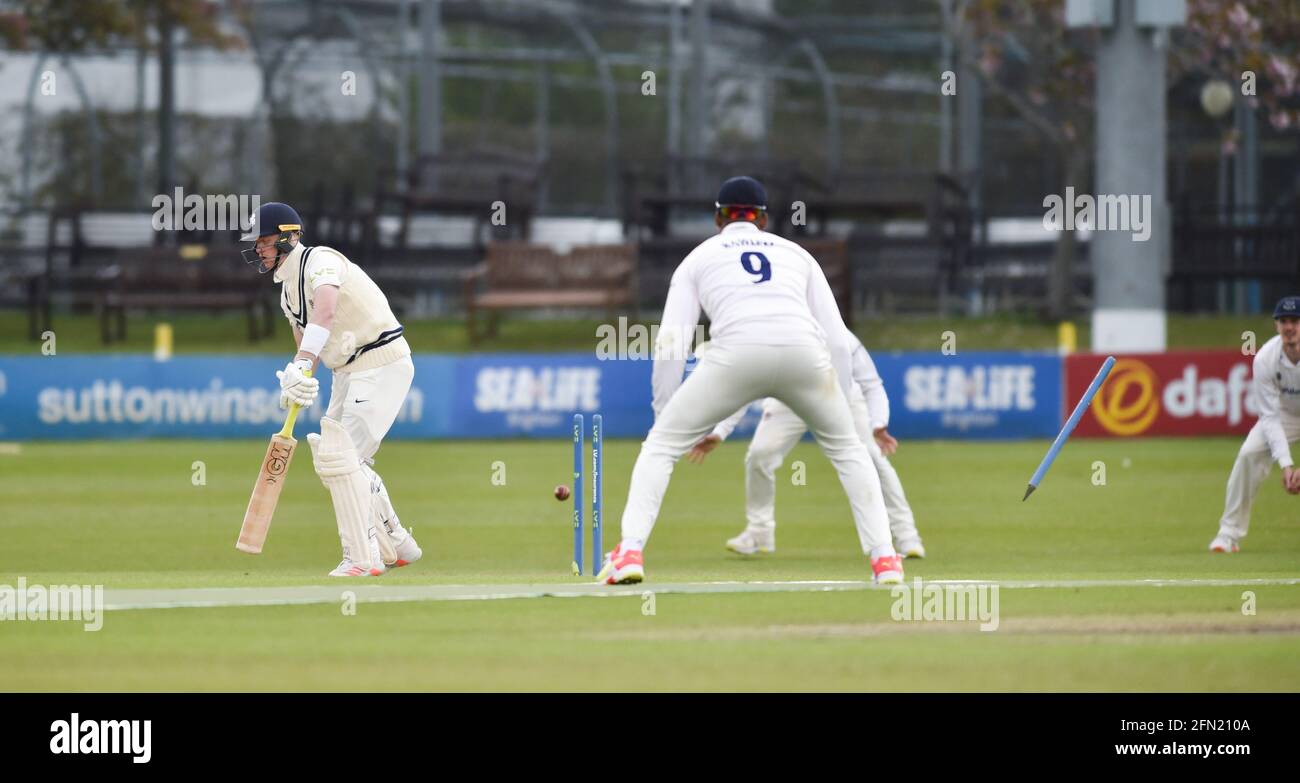 Hove, UK. 13th May, 2021. Jordan Cox of Kent is bowled by Ollie Robinson of Sussex for 24 runs on the first day of their LV= Insurance County Championship match at The 1st Central County Ground in Hove . : Credit: Simon Dack/Alamy Live News Stock Photo