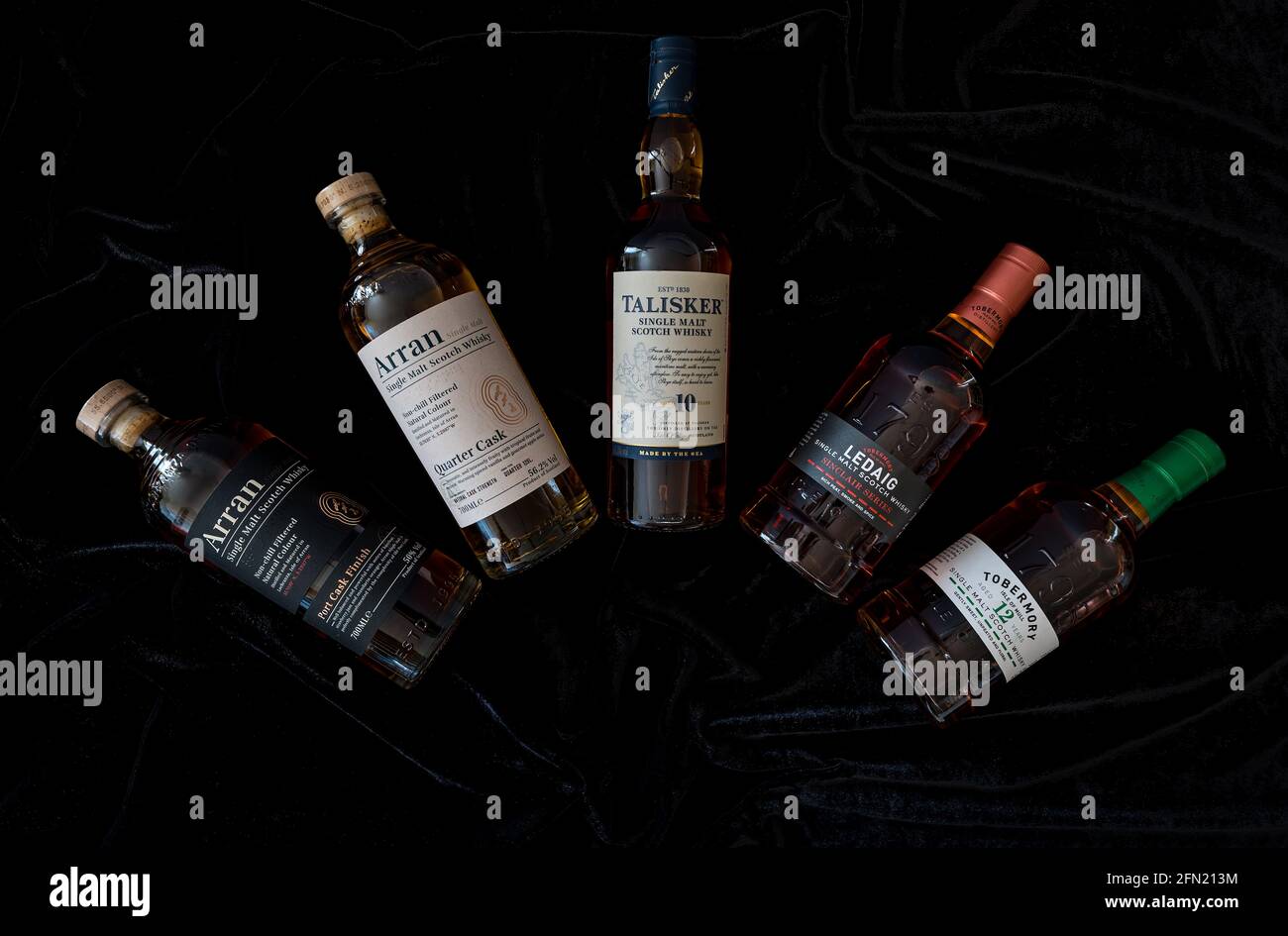 Scottish malt whisky bottles and brands, Scotland, UK: Arran, Talisker malt whisky, Ledaig whisky & Tobermory whisky bottle Stock Photo